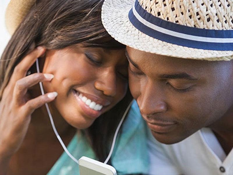 A couple listening to music together.