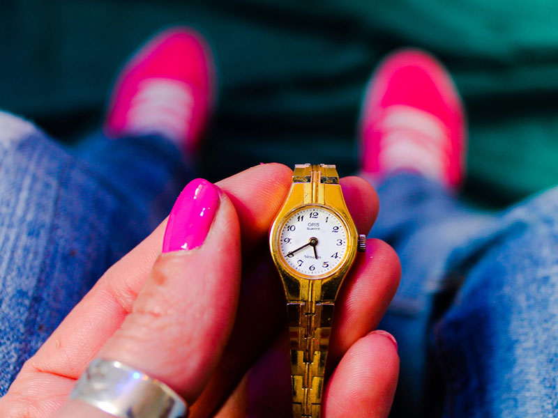 A woman waiting for her date to arrive after being stood up.