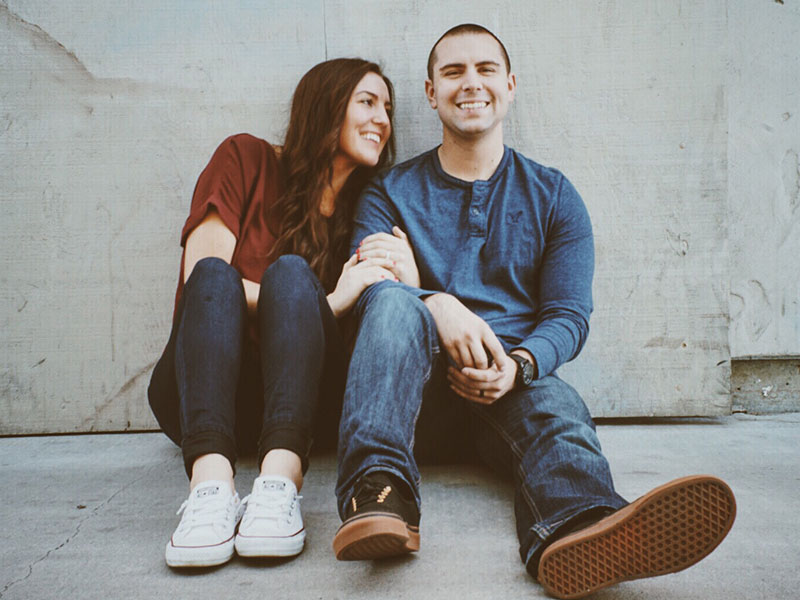 A woman who's with a guy she's creating an instant relationship with even though they haven't discussed it.