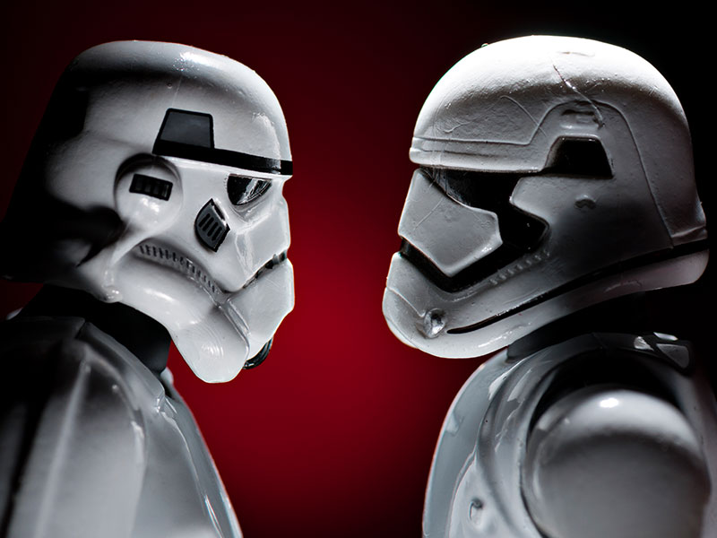 Two stormtroopers looking at each other as if in love.