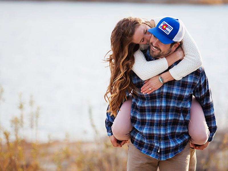 This girl kissing her boyfriend's ear knows what men want in a relationship.