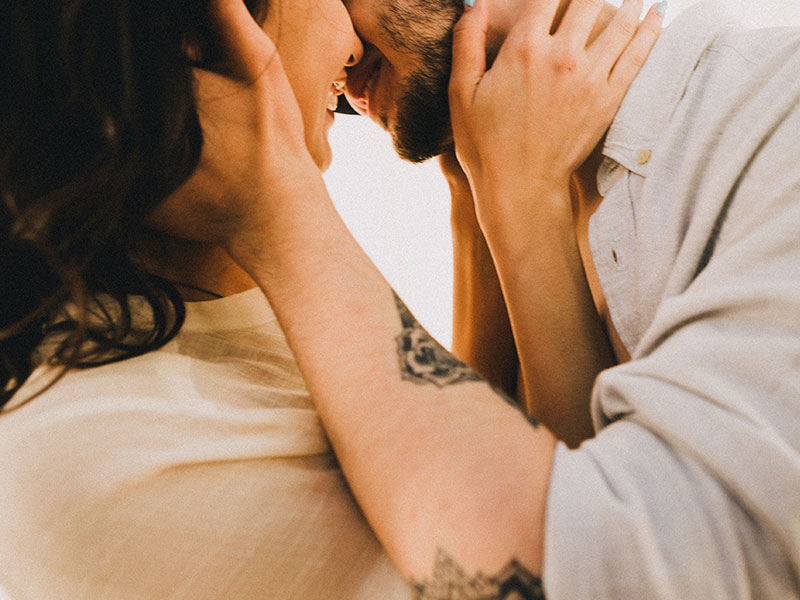 This woman kissing a man figured out how to get a guy's attention.