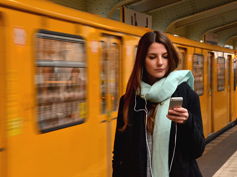 A woman actively online dating on her phone.