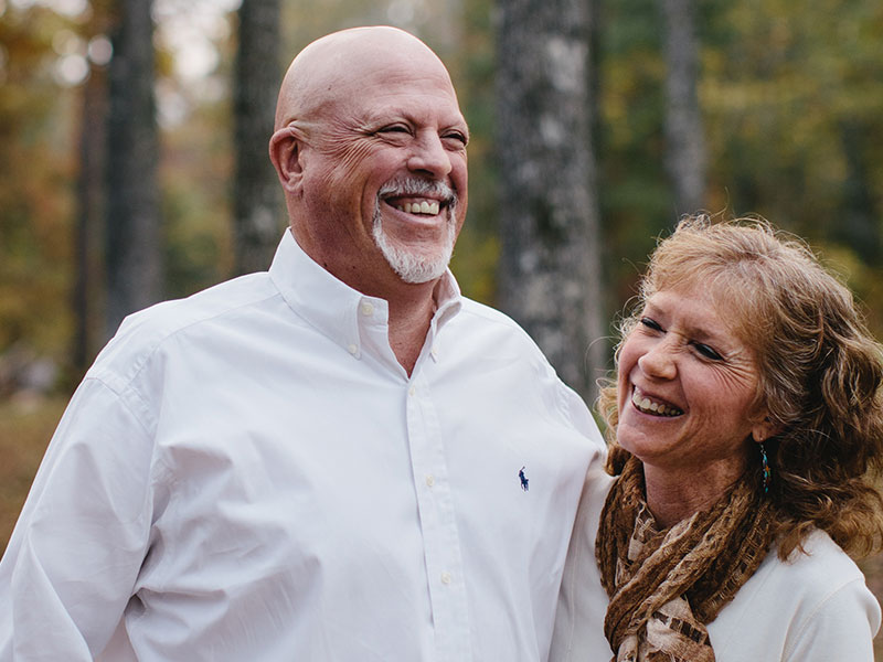 These dating tips are from these two baby crazy parents who are laughing in the woods.
