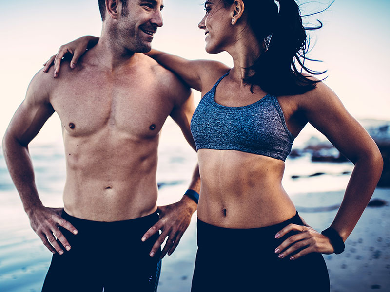 A strong, healthy couple exercising together.