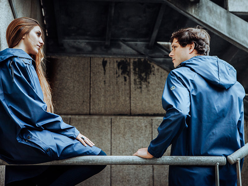 A couple who need some good relationship advice having a discussion about an important compromise in a stairwell.