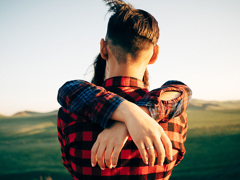 A girl hugging a man who's wondering if his relationship is moving too fast.