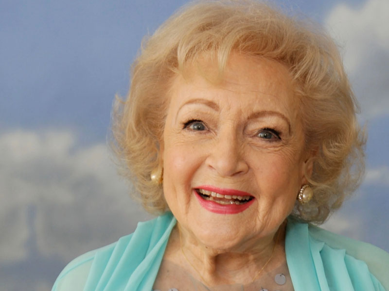 Betty white smiling at the camera about to give some dating tips.