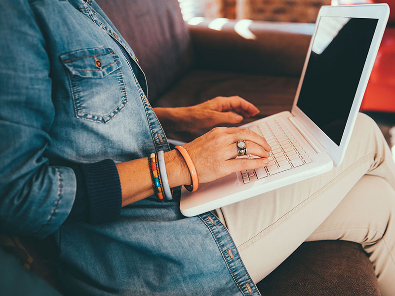 A woman online dating and avoiding romance scams.