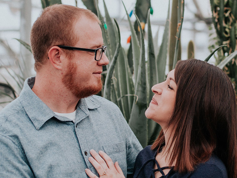 A couple online dating over 40, gazing into each other's eyes on a first date.