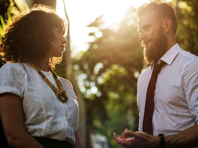 Two professionals look into each other's eyes and wonder what the other one is thinking.