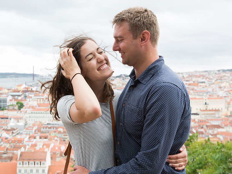 A man dating while separated, smiling and laughing as he hugs his date.