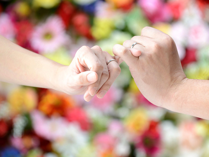 This couple learned what does a promise ring mean and are wearing their rings and 'holding fingers' to show how they feel.