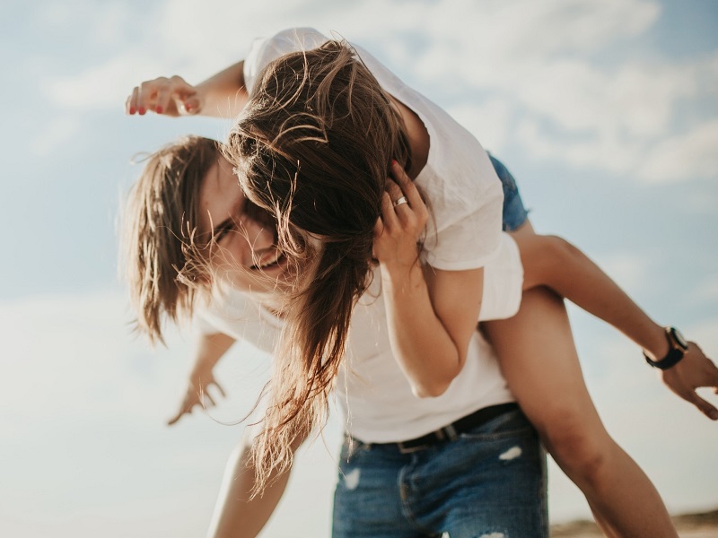 Young couple laughing showing what is true love