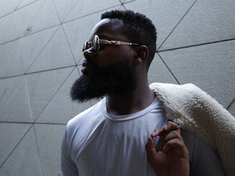 man standing with coat thinking about dating in your 30s as a man